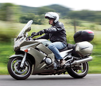 Photo of solo rider on a Kawasaki motorcycle